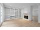 Bright living room offers built-in bookshelves, fireplace, and wood flooring at 70 Old Ivy Ne Rd # 29, Atlanta, GA 30342