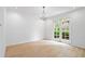 Empty living room with chandelier and french doors to the exterior at 70 Old Ivy Ne Rd # 29, Atlanta, GA 30342