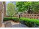 Charming brick patio with lush landscaping offers a private outdoor seating area at 70 Old Ivy Ne Rd # 29, Atlanta, GA 30342