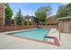 Refreshing community pool surrounded by brick walls and lush landscaping, ideal for relaxation and recreation at 70 Old Ivy Ne Rd # 29, Atlanta, GA 30342