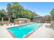 Beautiful community pool and brick pool house under a clear blue sky at 70 Old Ivy Ne Rd # 29, Atlanta, GA 30342