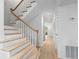 Wooden staircase with white risers leading to the upper level at 70 Old Ivy Ne Rd # 29, Atlanta, GA 30342