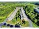 A stunning aerial view of townhomes surrounded by lush greenery and a winding road at 7725 Pierpoint Ln, Alpharetta, GA 30005