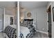 Comfortable bedroom offers a four-poster bed with black and white bedding and stylish decor at 7725 Pierpoint Ln, Alpharetta, GA 30005