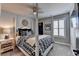 Comfortable bedroom offers a four-poster bed with black and white bedding and stylish decor at 7725 Pierpoint Ln, Alpharetta, GA 30005