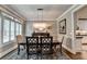 Elegant dining room features hardwood floors, chandelier, and classic decor at 7725 Pierpoint Ln, Alpharetta, GA 30005