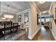 Dining room featuring hardwood floors, stylish lighting, and elegant decor at 7725 Pierpoint Ln, Alpharetta, GA 30005