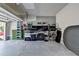Organized garage with epoxy flooring, slat wall storage system, and ample space at 7725 Pierpoint Ln, Alpharetta, GA 30005