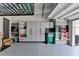 This garage includes slat walls for storage, cabinets for storing various items, and an epoxy floor for easy cleanup at 7725 Pierpoint Ln, Alpharetta, GA 30005