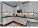 Bright kitchen featuring white cabinets, granite countertops, and stainless steel appliances, perfect for cooking at 7725 Pierpoint Ln, Alpharetta, GA 30005