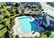 Aerial view of the community pool, surrounded by lounge chairs and lush landscaping at 7725 Pierpoint Ln, Alpharetta, GA 30005