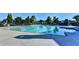 A clear blue community pool with surrounding furniture and landscaping, great for relaxing at 7725 Pierpoint Ln, Alpharetta, GA 30005