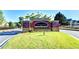 A brick 'Jamestown' sign atop manicured lawn and landscaping welcomes you to the neighborhood at 7725 Pierpoint Ln, Alpharetta, GA 30005