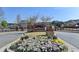 The 'Jamestown' sign is adorned with spring flowers in this manicured entrance to the community at 7725 Pierpoint Ln, Alpharetta, GA 30005