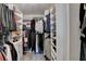 Well-organized walk-in closet with ample shelving and hanging space for clothes and accessories at 7725 Pierpoint Ln, Alpharetta, GA 30005