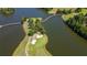 High angle aerial perspective of the golf course with water hazards and a small pedestrian bridge at 9889 Between The Grns, Villa Rica, GA 30180