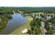 Stunning aerial shot of the golf course, a tranquil lake, and the surrounding wooded landscape at 9889 Between The Grns, Villa Rica, GA 30180