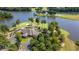 Breathtaking aerial view of a waterfront golf course community featuring a meticulously landscaped property and lush surroundings at 9889 Between The Grns, Villa Rica, GA 30180