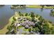 Aerial showcases golf course architecture along lake, offering a unique and picturesque golfing experience at 9889 Between The Grns, Villa Rica, GA 30180