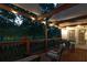 Inviting back porch featuring string lights, comfortable seating, and a serene outdoor ambiance at 9889 Between The Grns, Villa Rica, GA 30180