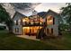 Spacious backyard featuring a two-story deck with outdoor seating and stairs leading to a patio at 9889 Between The Grns, Villa Rica, GA 30180