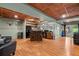 Finished basement with wood flooring, kitchenette, seating area, and exterior access at 9889 Between The Grns, Villa Rica, GA 30180