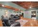 Large finished basement includes a media room, kitchenette and additional seating areas at 9889 Between The Grns, Villa Rica, GA 30180