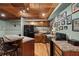 Basement kitchenette with breakfast bar, wood cabinets and granite countertops at 9889 Between The Grns, Villa Rica, GA 30180