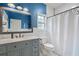Charming bathroom features subway tile, granite countertops, and stylish blue accents at 9889 Between The Grns, Villa Rica, GA 30180