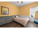 Comfortable bedroom showcases natural light, a dresser, and calm ambiance at 9889 Between The Grns, Villa Rica, GA 30180