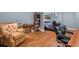 Cozy bedroom includes comfy chair, bookshelf, desk and bed, ideal for relaxation and productivity at 9889 Between The Grns, Villa Rica, GA 30180