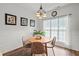 Cozy breakfast nook featuring a round wooden table, three chairs and natural light from a nearby window at 9889 Between The Grns, Villa Rica, GA 30180