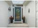 Inviting entryway with stylish front door and decorative planters at 9889 Between The Grns, Villa Rica, GA 30180