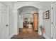 Elegant foyer with hardwood floors and arched doorways leading to the living area at 9889 Between The Grns, Villa Rica, GA 30180
