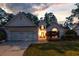 Charming single-Gathering home featuring a manicured lawn and welcoming front entrance with beautiful landscape at 9889 Between The Grns, Villa Rica, GA 30180