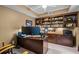 Home office boasts built-in shelves and cabinets with a large modern desk workspace at 9889 Between The Grns, Villa Rica, GA 30180