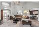 Open concept living room with vaulted ceilings, hardwood floors, and a neutral color scheme at 9889 Between The Grns, Villa Rica, GA 30180