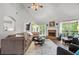 Spacious living room with a cozy fireplace and abundant natural light at 9889 Between The Grns, Villa Rica, GA 30180