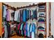 Organized walk-in closet provides ample storage space with shelving and hanging rods at 9889 Between The Grns, Villa Rica, GA 30180