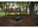 Water feature in backyard, with water pump, lily pads, and a hammock among the trees at 9889 Between The Grns, Villa Rica, GA 30180