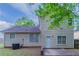 Exterior view of the back of the home, showing the back door and windows at 2319 Rambling Way, Lithonia, GA 30058