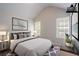 This bedroom features a neutral color palette, large windows and a comfortable queen sized bed at 2319 Rambling Way, Lithonia, GA 30058