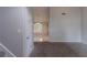 Open-concept living room with neutral paint, carpet, and a staircase to another level at 2319 Rambling Way, Lithonia, GA 30058