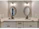 This bathroom vanity boasts double sinks, quartz countertops, and modern fixtures for a stylish and functional space at 5299 Noble Village Way, Lilburn, GA 30047
