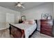 This bedroom features warm wood floors, a ceiling fan, and a restful atmosphere at 5299 Noble Village Way, Lilburn, GA 30047