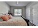 This bedroom features warm wood floors, a ceiling fan, and a restful atmosphere at 5299 Noble Village Way, Lilburn, GA 30047