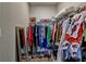 Walk-in closet with organized storage solutions, including rods, shelves, and a full-length mirror at 5299 Noble Village Way, Lilburn, GA 30047