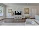 Bright living room with hardwood floors, neutral paint, and a decorative display and art at 5299 Noble Village Way, Lilburn, GA 30047