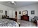 Spacious main bedroom featuring wood floors, classic furniture, and ample closet space at 5299 Noble Village Way, Lilburn, GA 30047