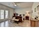 Serene main bedroom featuring a cozy bed, French doors, and elegant decor at 5299 Noble Village Way, Lilburn, GA 30047
